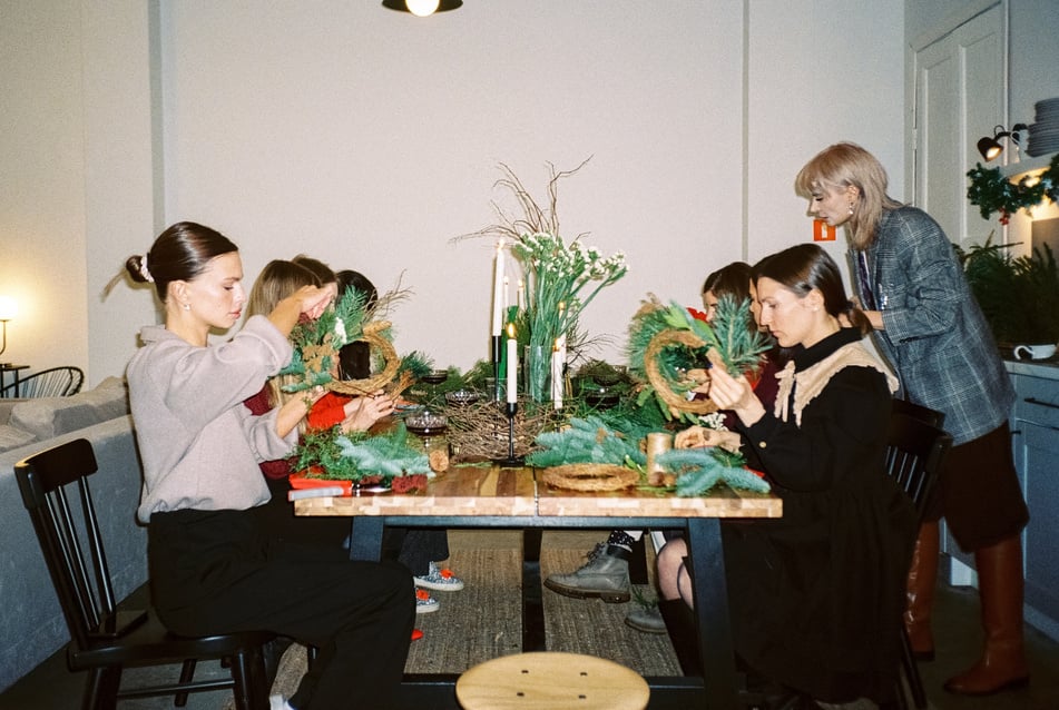 Women Preparing Christmas Wreaths at a Workshop